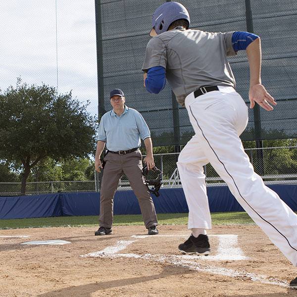 Champion Sports Universal Home Plate with two persons in the field