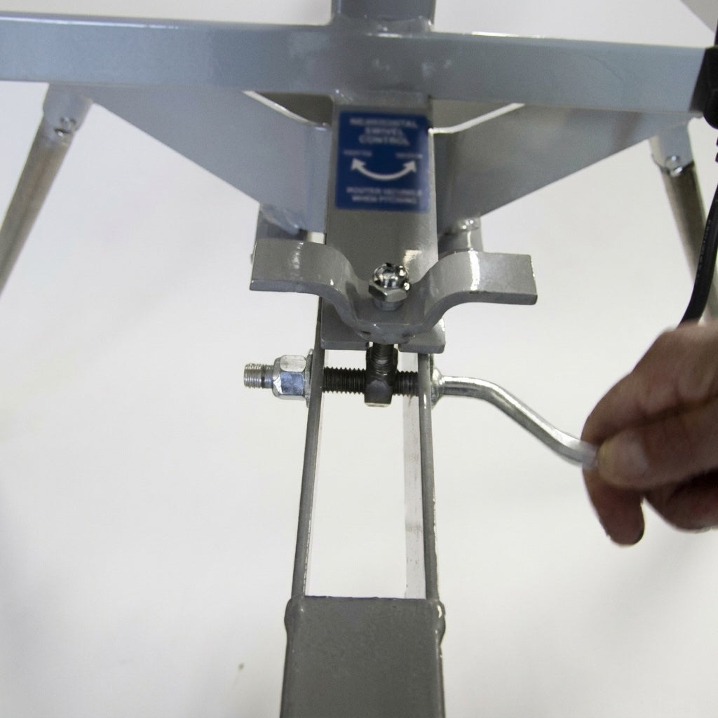 A hand turning the Jr. Hack Attack's elevation crank