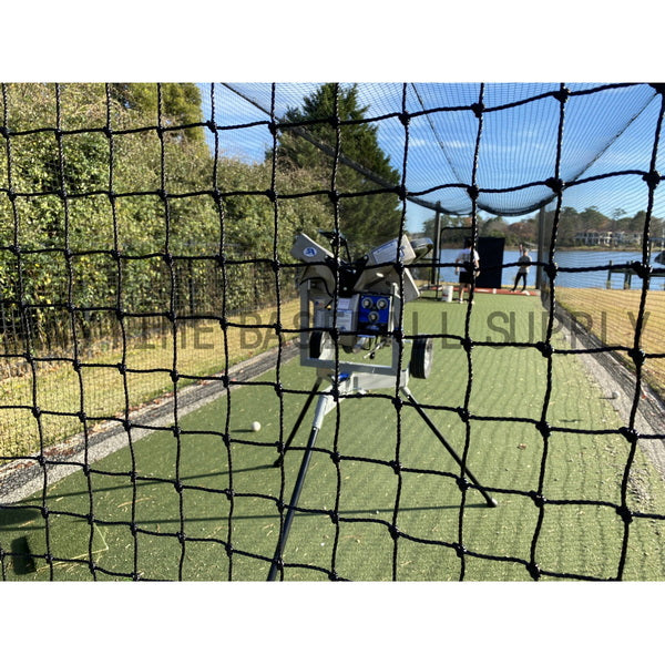 Hack Attack 3 Wheel Pitching Machine rear view inside batting cage