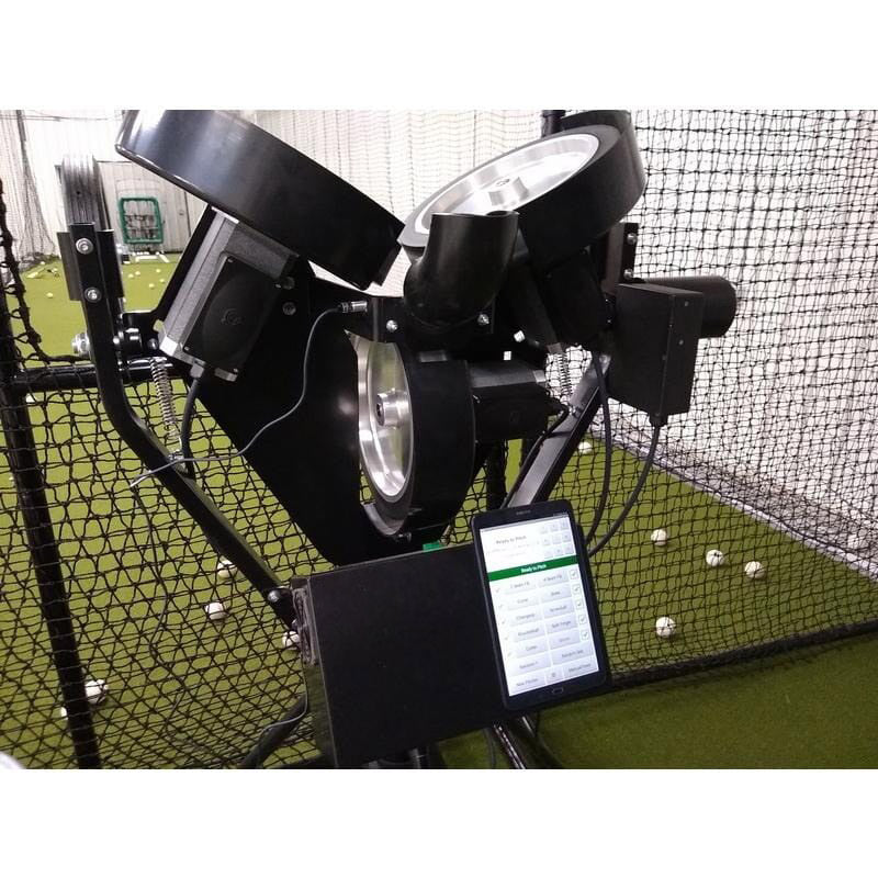 Spinball iPitch Programmable 3 Wheel Pitching Machine inside batting cage with protections screen