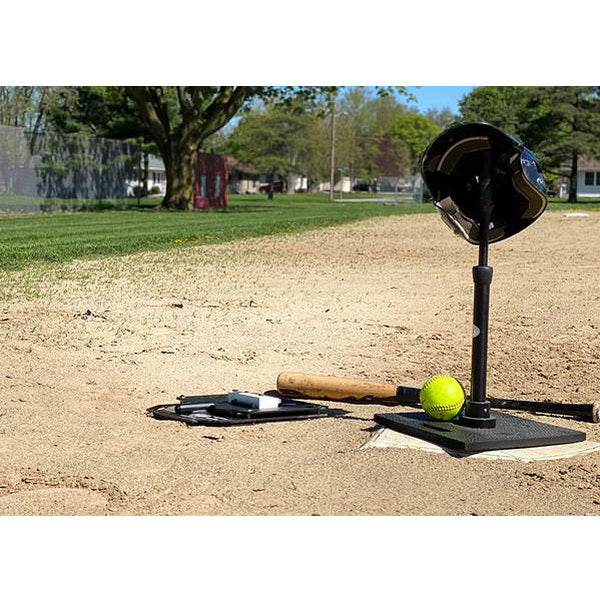 The King Of The Swing Baseball Swing Trainer on field with other equipment