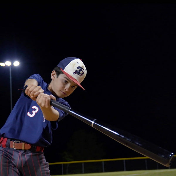 Youth Pro Maple Composite Wood Baseball Bat With Player Swinging