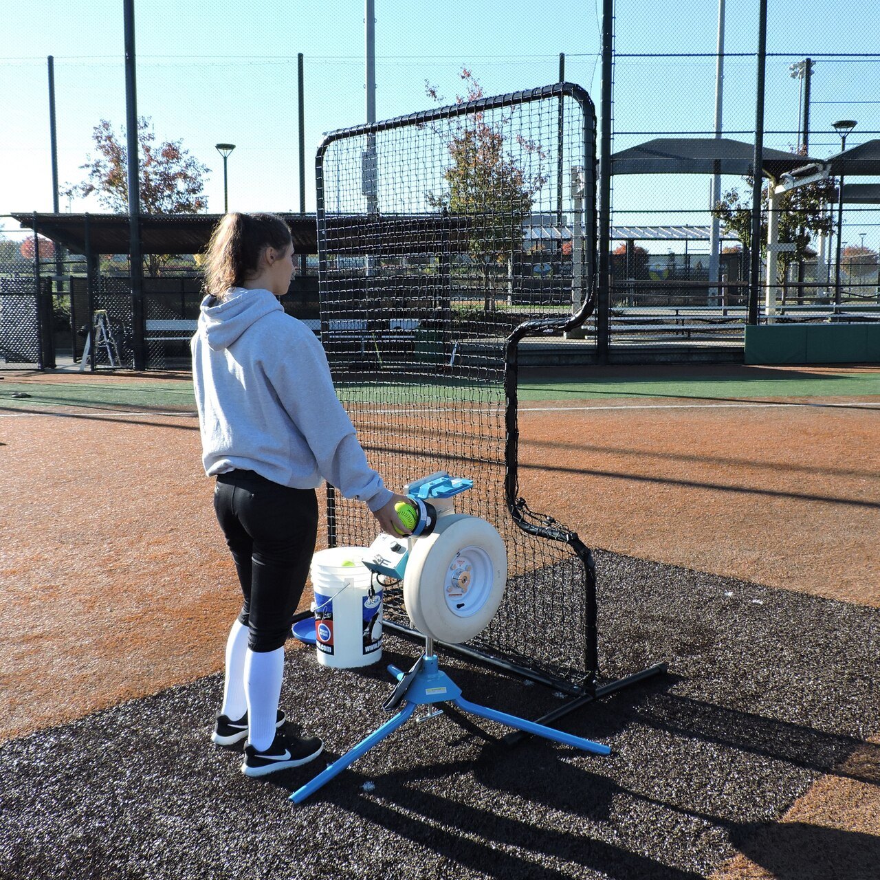 Softball Protective C-Shaped Screen with Pitching Machine and Player