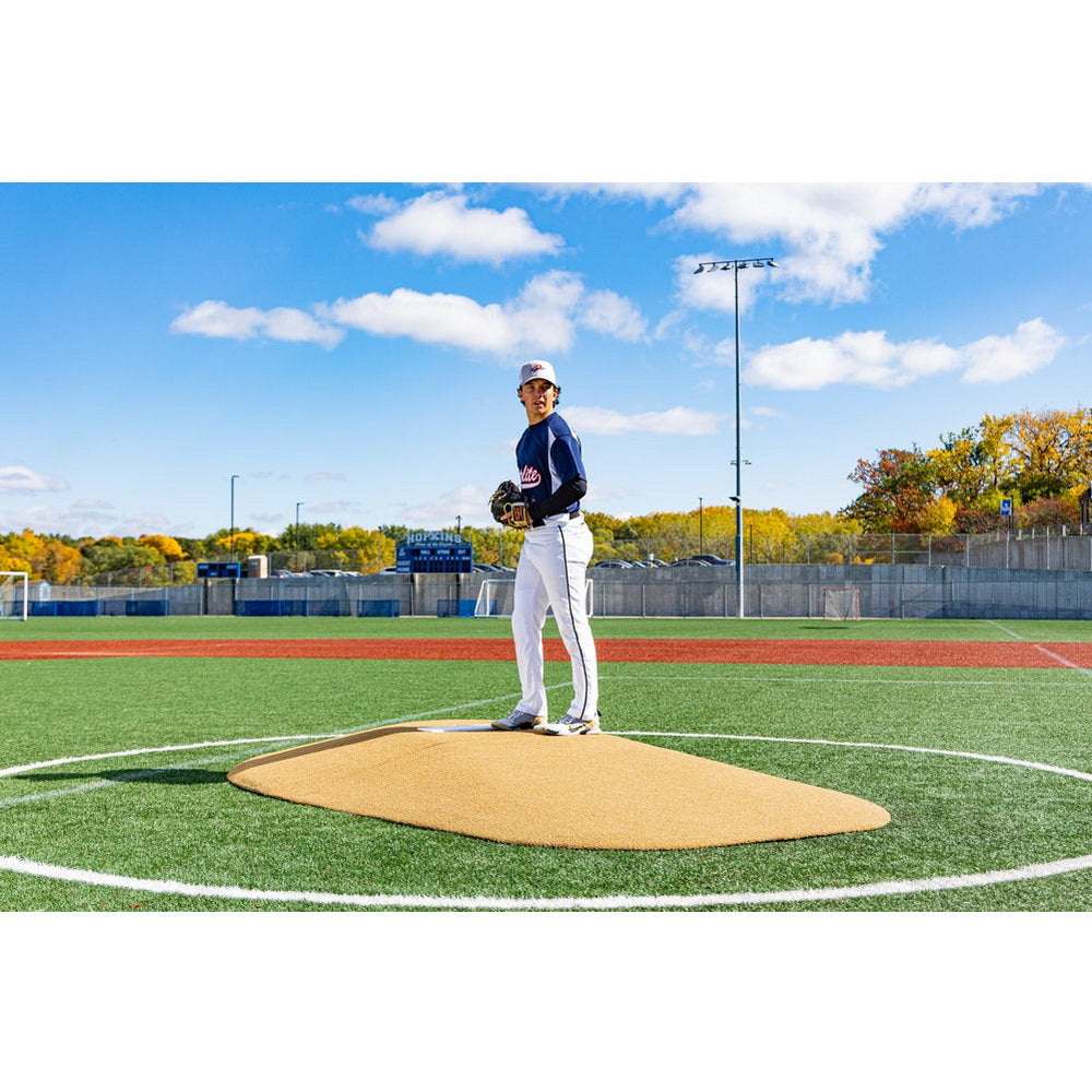 PortoLite Two-Piece 10" Portable Pitching Mound tan player standing