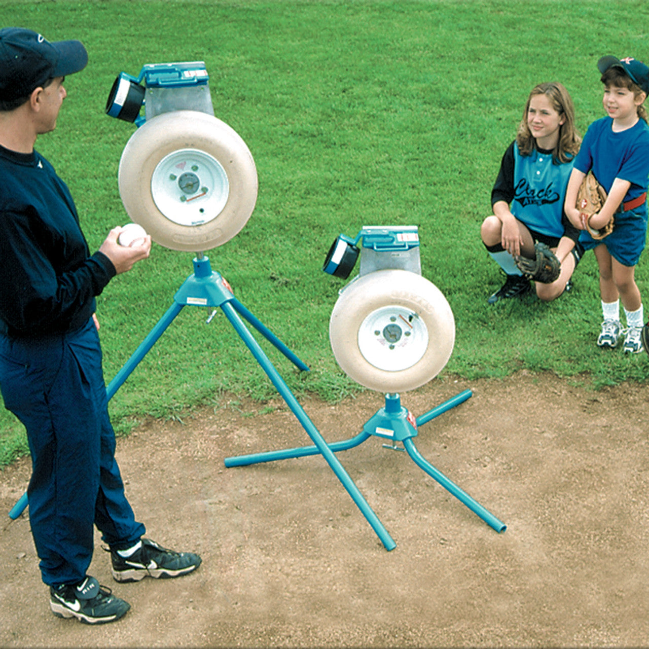 Jugs BP1 Pitching Machine for Baseball or Softball Side by Side being Demonstrated 