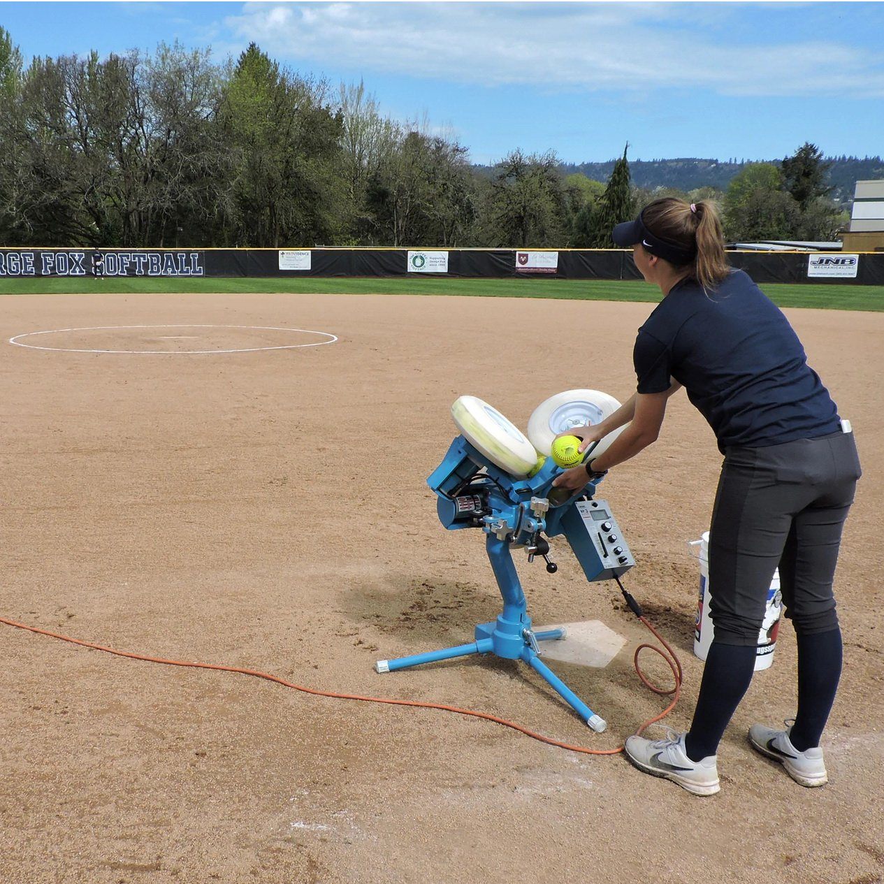 Jugs BP®3 Pitching Machine for Softball and Player 