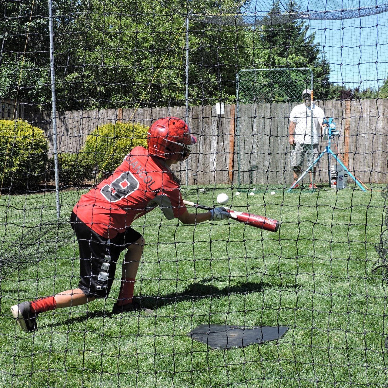 Jugs Hit at Home Complete Backyard Batting Cage Close Up View with Batter