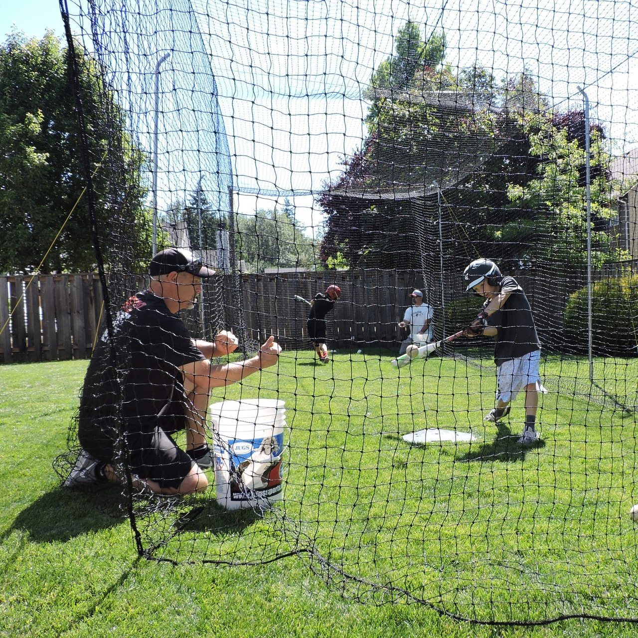 Jugs Hit at Home Complete Backyard Batting Cage Practice with Kid Batter