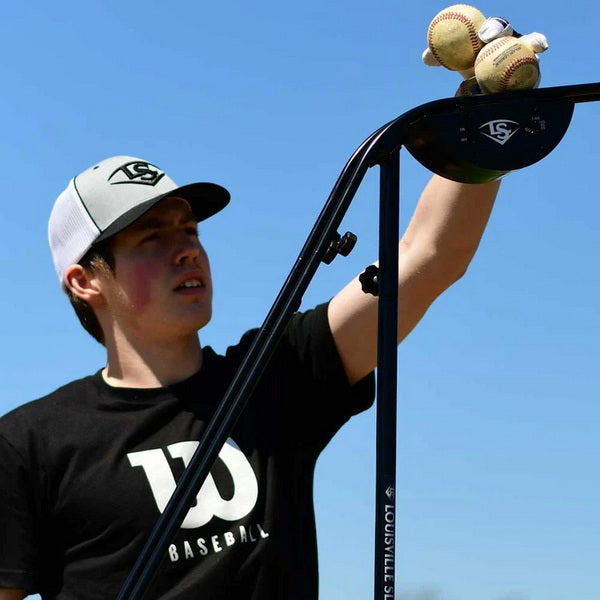 Louisville Slugger Soft-Toss Pitching Machine  With Player Loading Balls