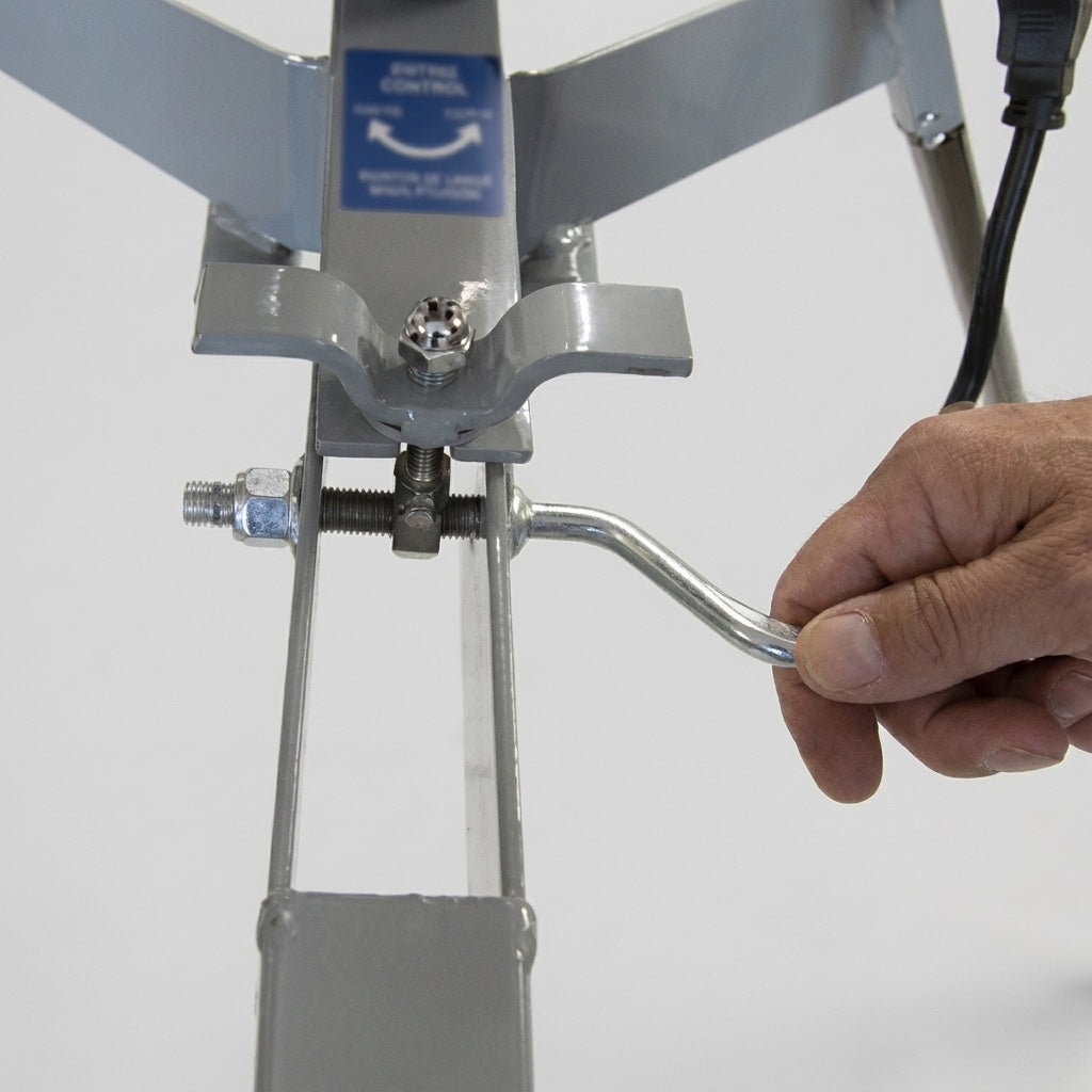 A hand turning the Hack Attack's elevation crank